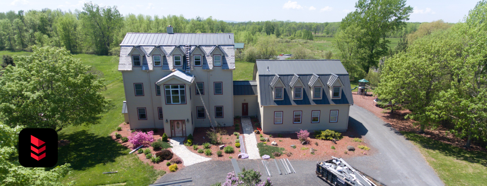 Large country-style Vermont home with standing seam roof replacement by RoofPros.Plus